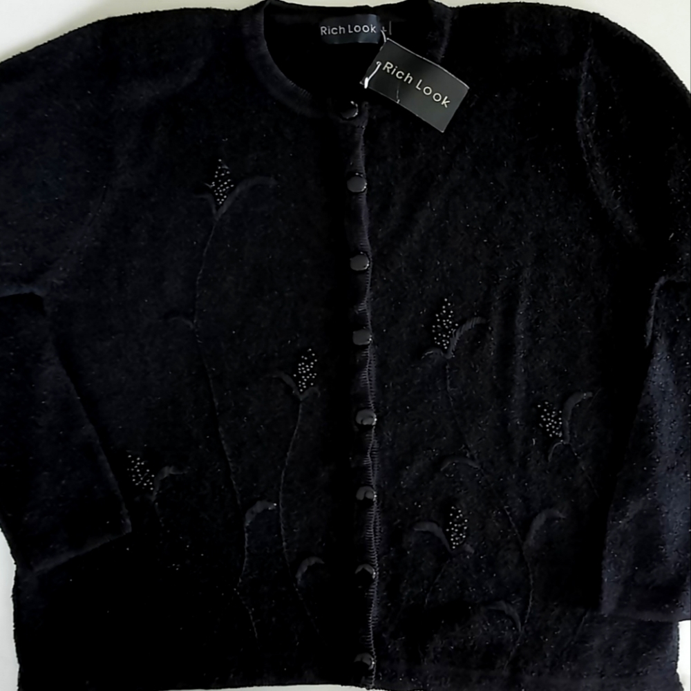 Black botton down sweater with embroidery and beading.